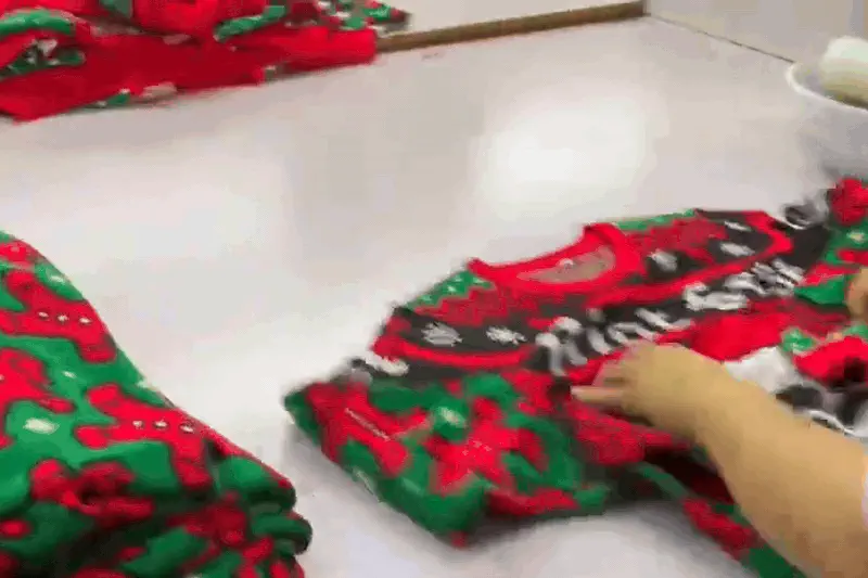 Custom Christmas jumper design options including colours, pattern layout and logo placement