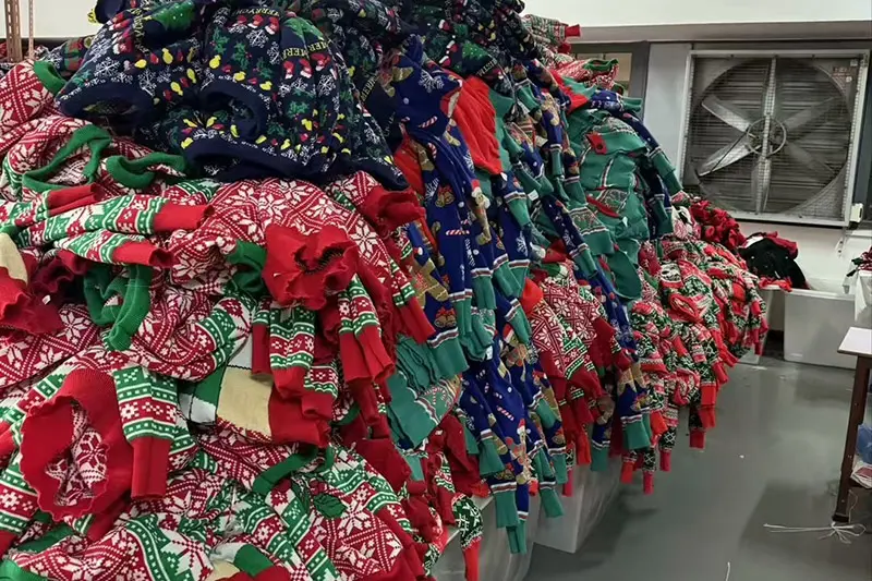 Acrylic Christmas jumper material sample checked for softness colour and knit structure